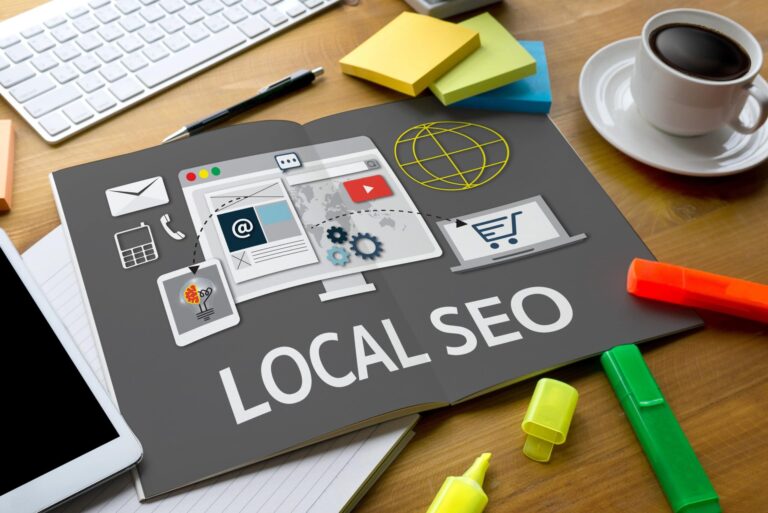 Local SEO concept illustration showing digital marketing elements like website optimization, email, mobile, and e-commerce on a desk workspace.